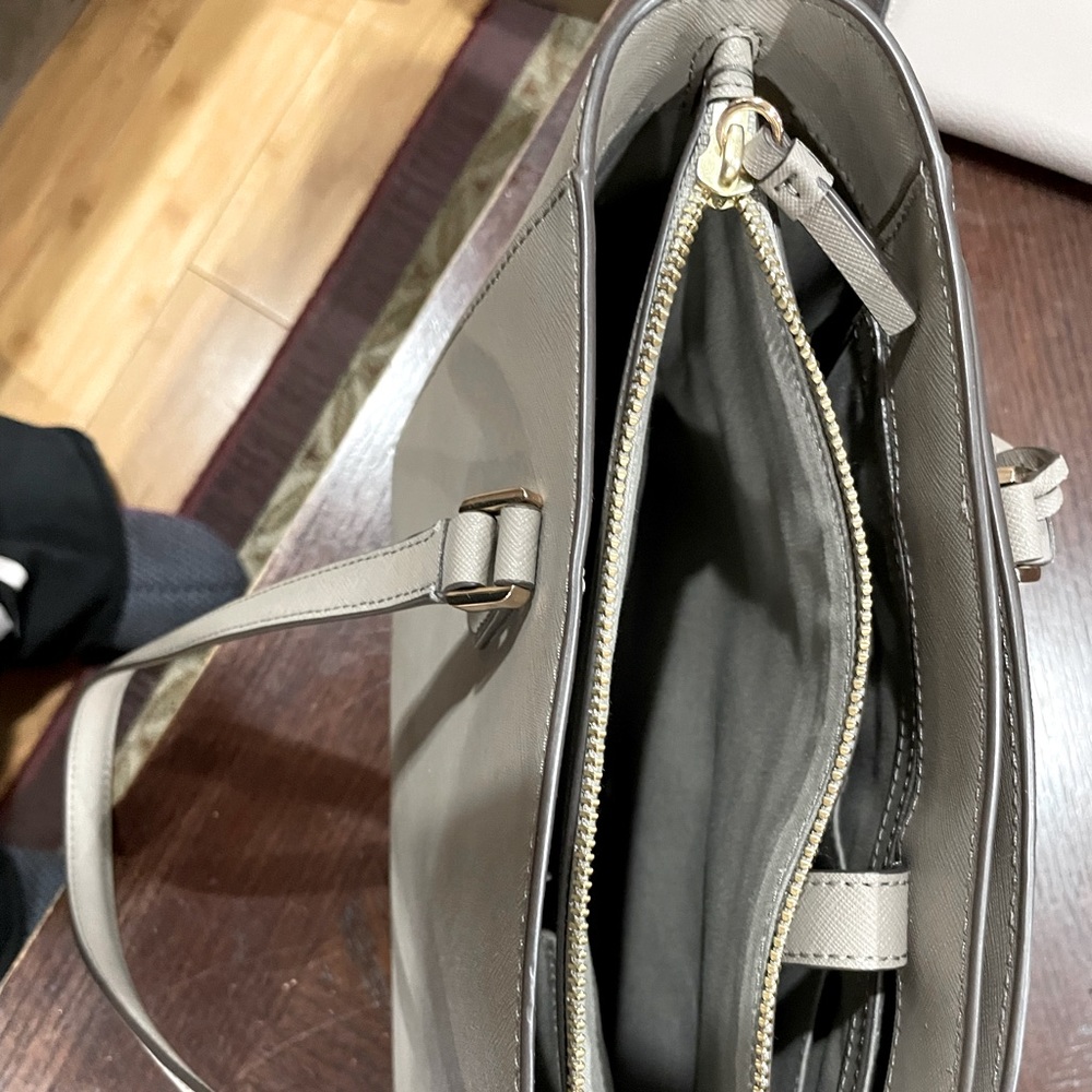 Used in great condition Tory Burch bag. 3 compartments, one has a zipper.